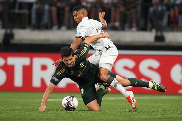 A Straight-Faced Thumbs-Up